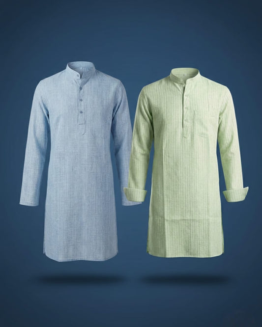 Front view of two standalone men's long kurtas floating against a dark blue studio background. The left kurta is light blue with subtle vertical stripes, and the right kurta is light green with stripes, a chest pocket, and folded sleeves. Both feature mandarin collars.